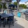a grill and chairs outside