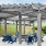 a covered patio with chairs and tables