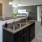 a kitchen with a marble island