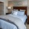 a bed with plush bedding
