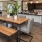 a kitchen with a table and chairs
