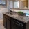 a kitchen with marble counters