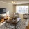 a living room with a tv and couches