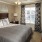 a bedroom with a bed and a table