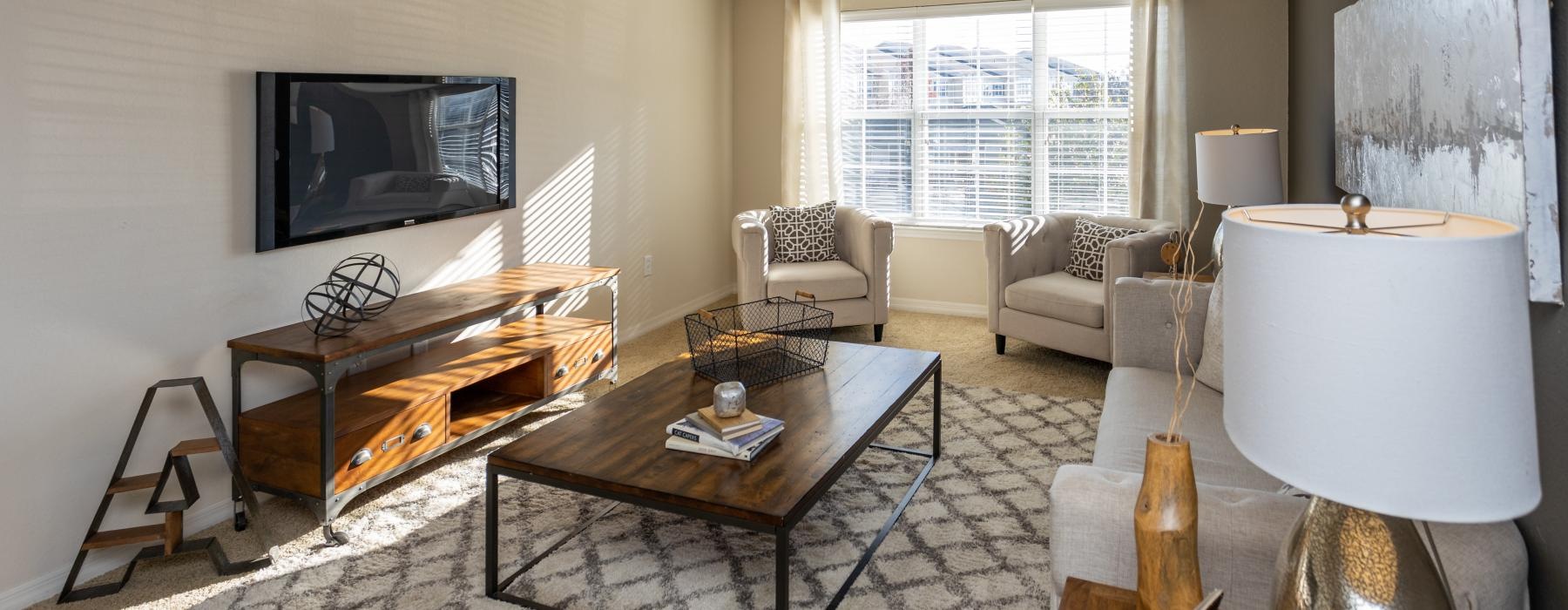 a living room with a piano and a television